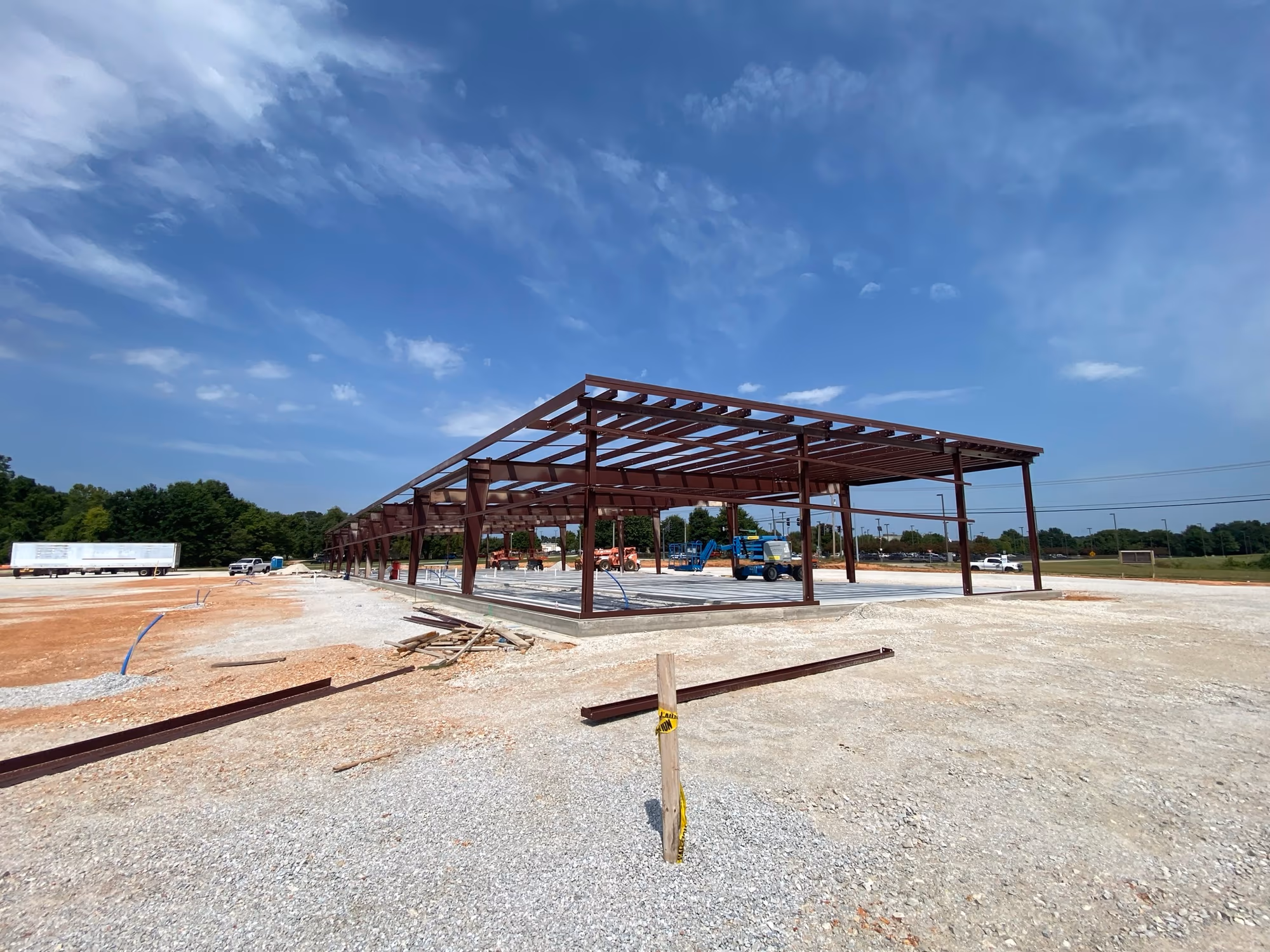 A wide clear span between steel columns, with no interior posts breaking up the floor area